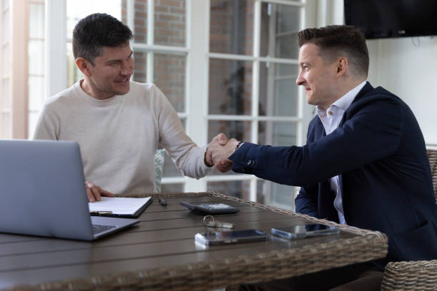 istock Real estate agent and businessman conclude agreement 1516607059