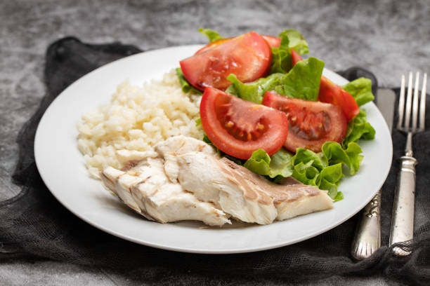 istock boiled fresh fish with boiled rice and fresh salad 1516607099
