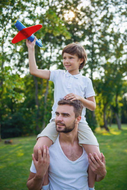 istock Dad and son resting outdoors 1516607968