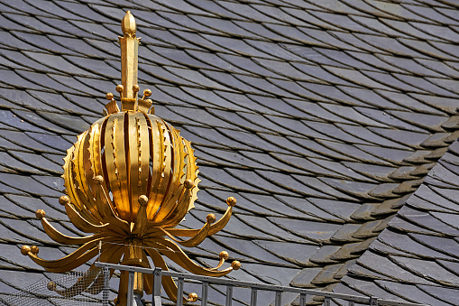 Wuerzburg, Germany - July 03, 2023: gilded ball on the roof of the Dom Museum in Würzburg.