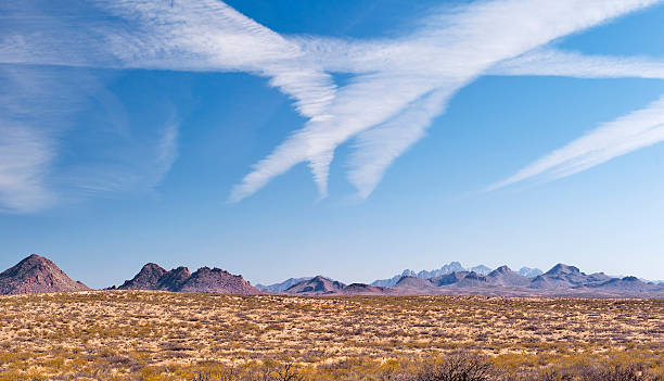 Contrails over mountains near Las Cruces stock photo