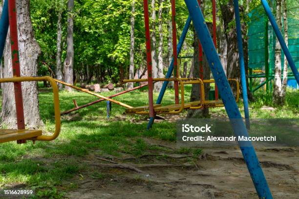 Empty Multicolored Swing In The Park On A Summer Day Stock Photo - Download Image Now