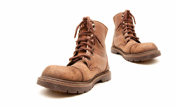 istock Brown old boots isolated on white background 151666387