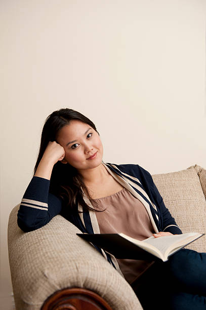 istock Young Woman Relaxing With A Book 151667065