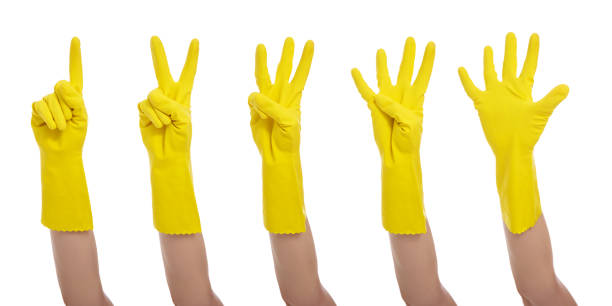 istock hands in yellow gloves show one, two, three, four, five fingers isolated on white background 1516687893