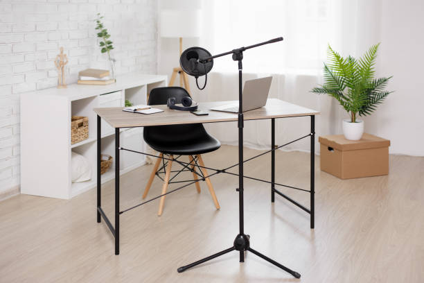 istock podcast and blogging concept - workplace with computer and microphone 1516689147