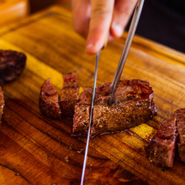 istock A Man Chopes A Beef Shoulder In A Wood Board 1516694071