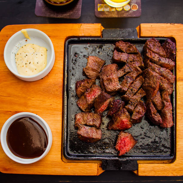 istock Barbecue Meat Board Served With Beef Shoulder And Side Sauces 1516694104