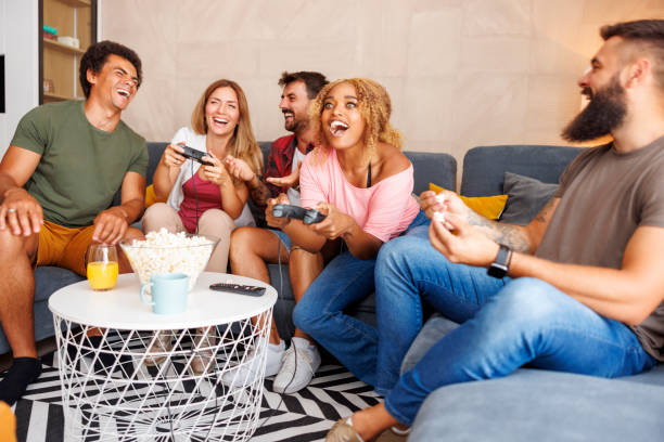 istock Friends having fun playing video games 1516697997