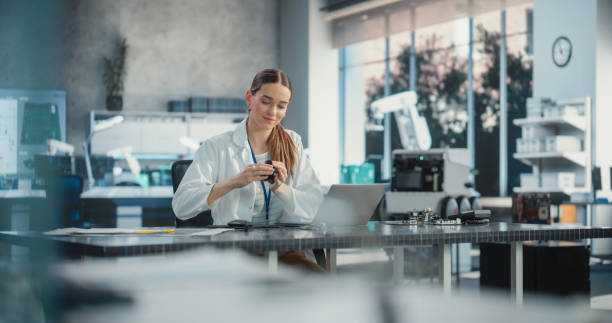 istock Portrait of Professional Female Scientist Working in Industrial Lab Using Laptop Computer. Successful Project Manager Making Strategy Plans for Industrial Production Company, Using Advanced Technology 1516698548