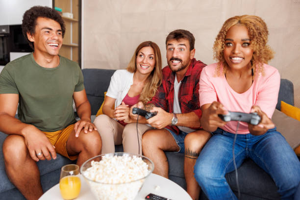 istock Friends having fun playing video games at home 1516698552