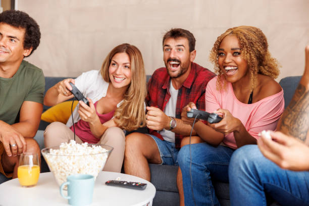 istock Friends having fun playing video games while spending leisure time together at home 1516699105