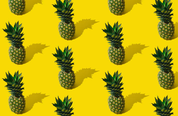 istock Fresh tropical summer fruit pattern made of pineapple on light yellow background. Trendy minimal ananas pattern layout. Natural exotic summer food concept. Pineapple aesthetic. 1516731866