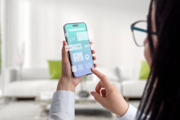 istock User interface and experience concept app on smart phone in woman hands. Clean design with flying app modules concept 1516749462