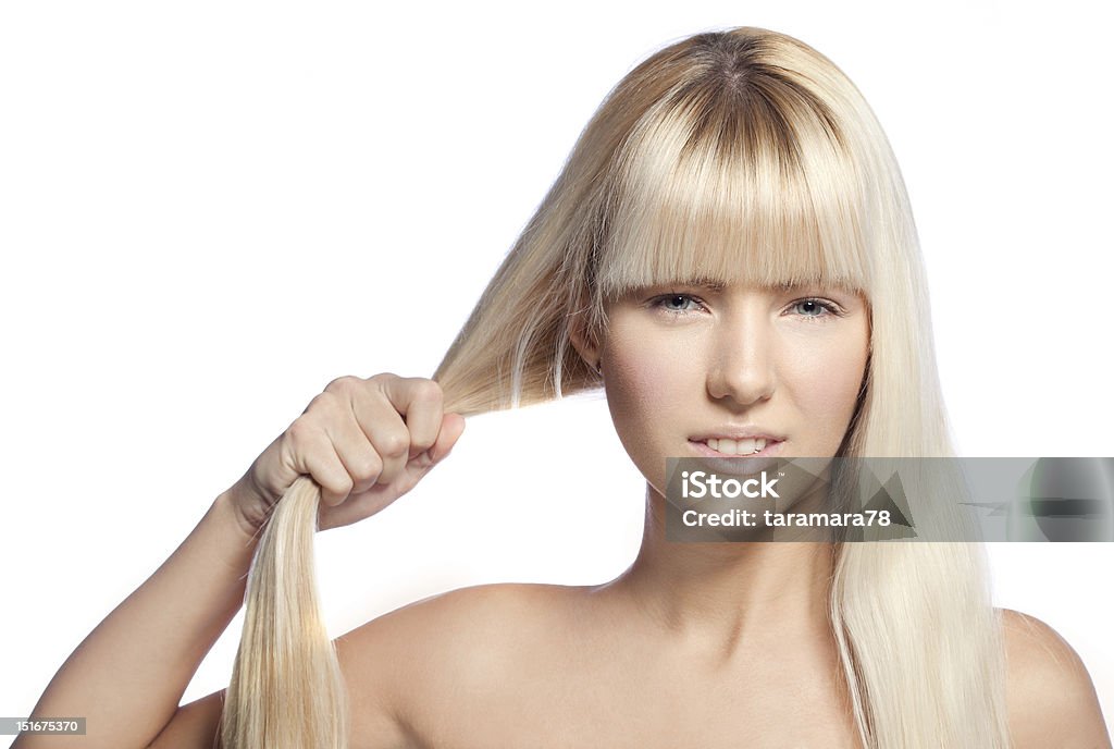 Strong hair Beautiful blond  girl pulling her hair. Adult Stock Photo