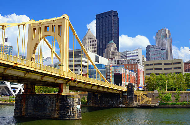 Roberto Clemente bridge over Allegheny River in Pittsburgh Skyscrapers in downtown at the waterfront of Pittsburgh, Pennsylvania, USA. sixth street bridge stock pictures, royalty-free photos & images