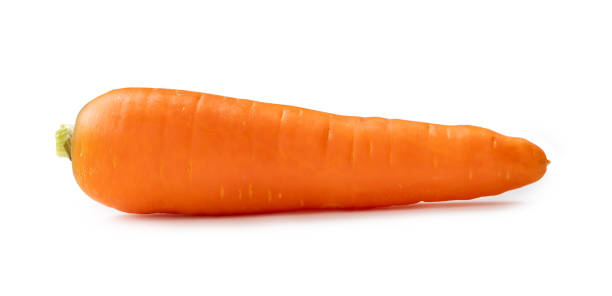 istock Single fresh orange carrot isolated on white background with clipping path. Close up of healthy vegetable root 1516798436