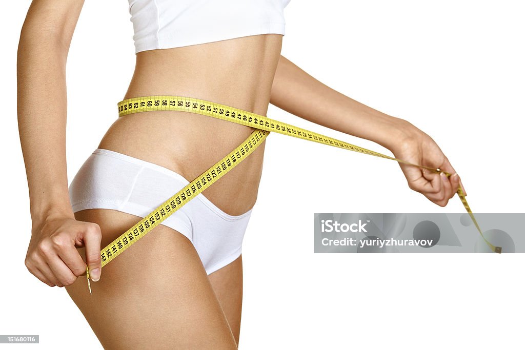 Mujer medir su waistline.  Cuerpo delgado perfecto.  Dieta - Foto de stock de Cuerpo humano libre de derechos