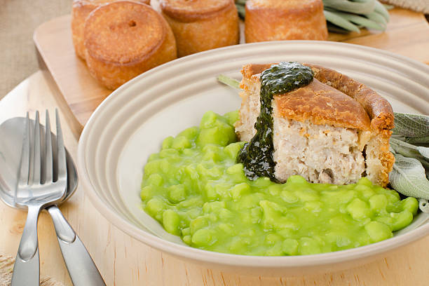 istock Melton Mowbray Pork Pies, Mushy Peas & Mint Sauce. 151680572