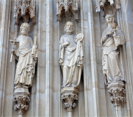 Vienna - The apostle Jacob, Peter and John from west portal of Minoriten gothic church