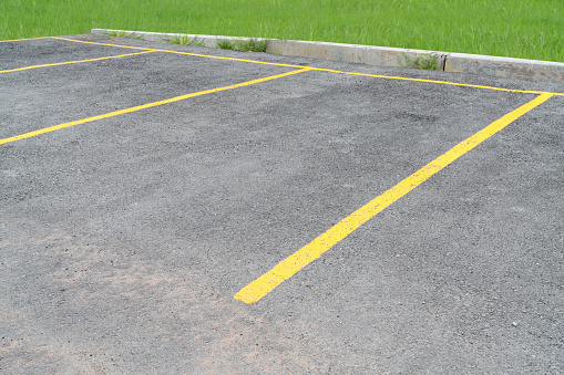 yellow lines parking on asphalt background