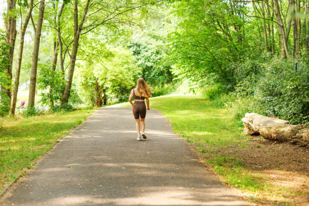 istock Woman running in the park 1516842053