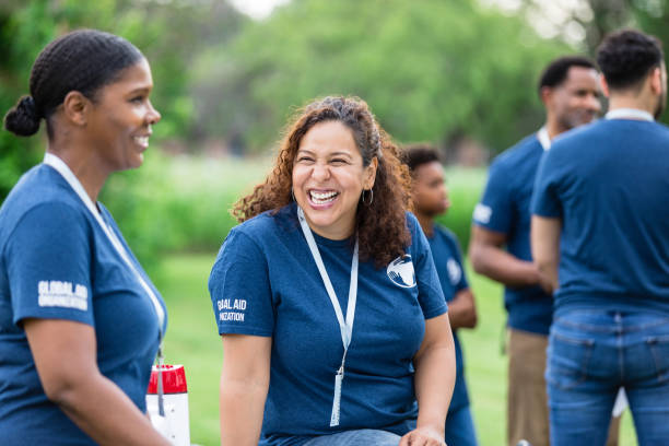 istock Diverse volunteers laugh and talk while waiting to begin 1516845933