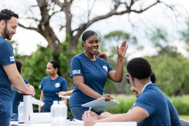 istock Multiracial group of volunteers talk together before beginning work 1516845954