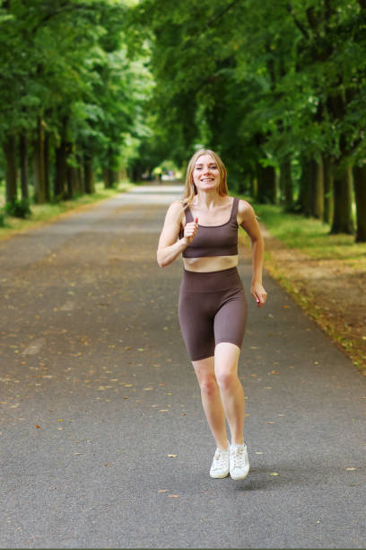 istock Woman running in the park 1516848714