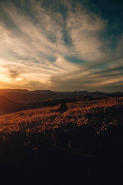 istock Celestial Spectacle: Sunset with Clouds in a Vast Sky 1516858442