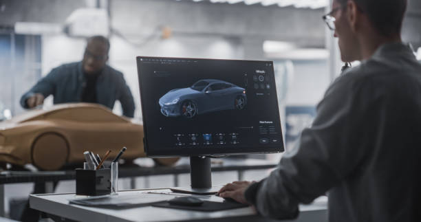 istock Automotive Designer and Modeler Working as a Team on Creating a Futuristic Car in a Studio. Engineer Working on Digital Render on Desktop Computer, African Sculptor Creating a 3D Clay Model 1516869780