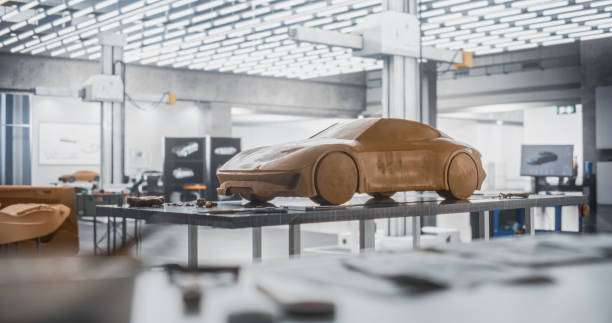 Concept Car Industrial Plasticine Clay Model Standing on a Table in an Empty Creative Studio Without People. Research and Development Agency at Prototype Vehicle Production Factory. Establishing Shot
