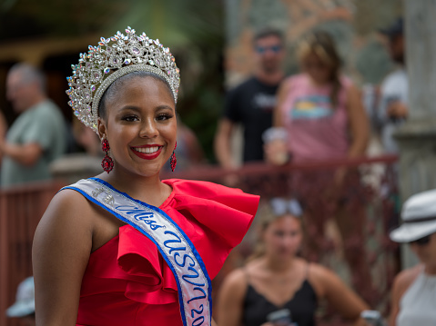 Cruz Bay, St John/US Virgin Islands-July 04, 2023: Fourth of July Carnival celebration in Cruz Bay, Costumed Carnival queen parading through the street, in Cruz Bay.