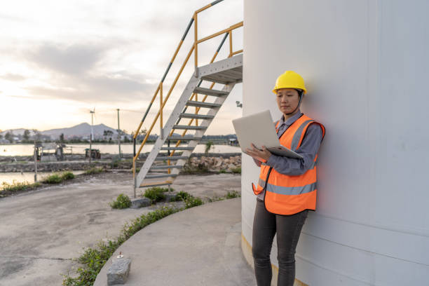 istock A female worker is using a computer next to a wind turbine 1516898503