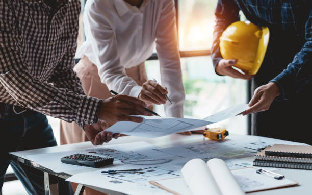 istock Architect or engineers are meeting to discuss home design. modify plans build a construction project and modify the work according to the needs of the customer. 1516898757