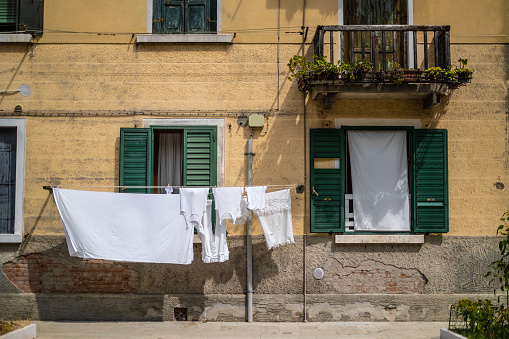 Laundry dried on a street in Venice is hung on a rope