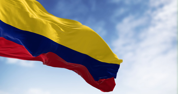 Colombia national flag waving in the wind on a clear day. Horizontal tricolor of yellow, blue, and red. Latin american country. 3d illustration render. Fluttering fabric. Selective focus