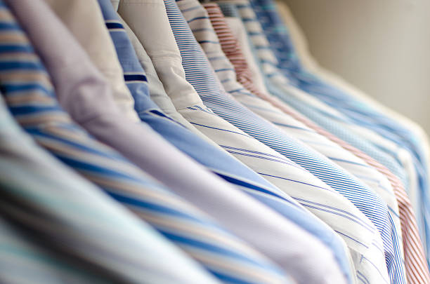 istock Several ironed mens shirts in a wardrobe 151693152