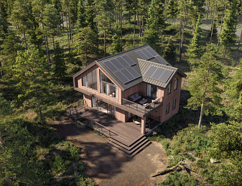 Aerial view of a modern forest house with solar panels. 3d rendering of a bungalow in green forest with terrace and driveway.