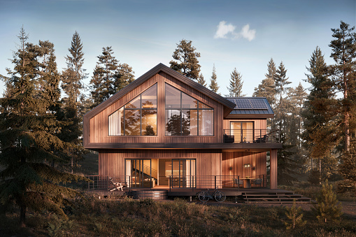 3d rendering of forest house surrounded by trees. Digitally generated image of a luxurious style forest bungalow during sunset.