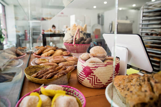 Small local bakery shop freshly baked pastries. No people. Horizontal full length indoors shot. This was taken in Montreal, Quebec, Canada.