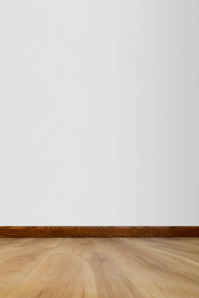 istock Empty room with wood floor and white wall - copy space 1516960006