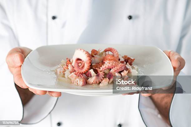 Seafood Dish Stock Photo - Download Image Now - Chef, Octopus, Preparing Food