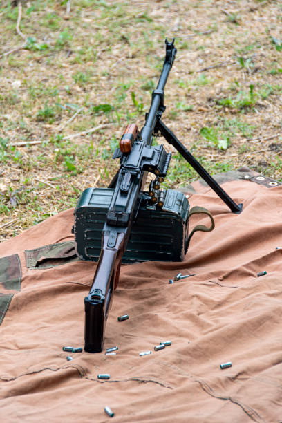 istock Soviet-made PK machine gun and camouflage netting.. 