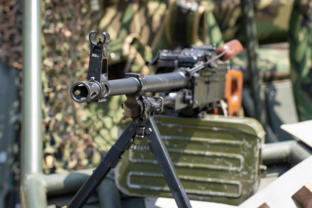 istock Soviet-made PK machine gun and camouflage netting.. 