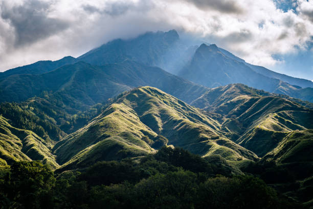 istock sunlight shining through the clouds onto the mountains 1517039021