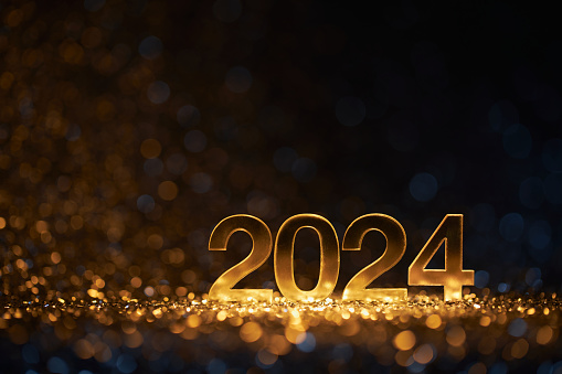 Golden New Year 2024 on defocused lights - Party Celebration Christmas Gold