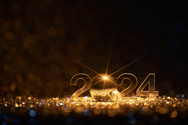 Merry Christmas and Happy New Year 2024 - Defocused Party Celebration Gold stock photo