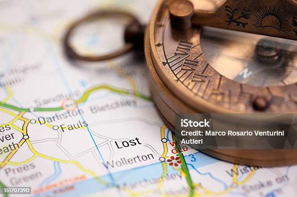 Lost On The Map Travel Concept With Compass Stock Photo - Download Image Now - Arranging, Backgrounds, Begging - Social Issue