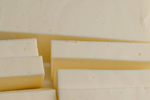 istock Sliced cream cheese for salads 1517076994